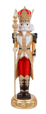 Decorative nutcracker figurine dressed as a king with a crown, staff, and red outfit on a white background.