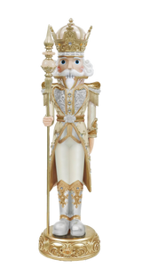 Decorative nutcracker figure with a crown and ornate outfit on a white background