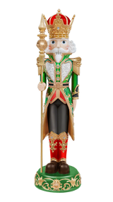 Decorative nutcracker figurine with a crown, holding a scepter, on a white background