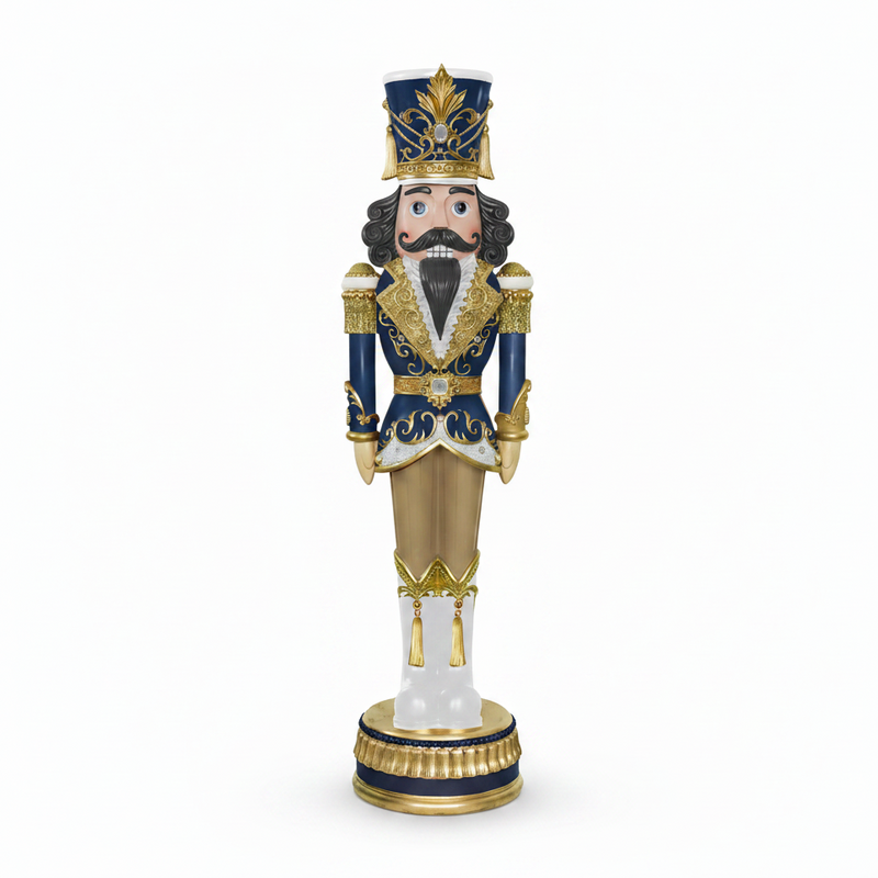 Decorative nutcracker figurine with blue and gold attire on a white background