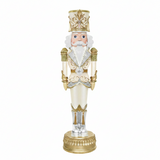 Decorative nutcracker figurine with gold and white attire on a white background