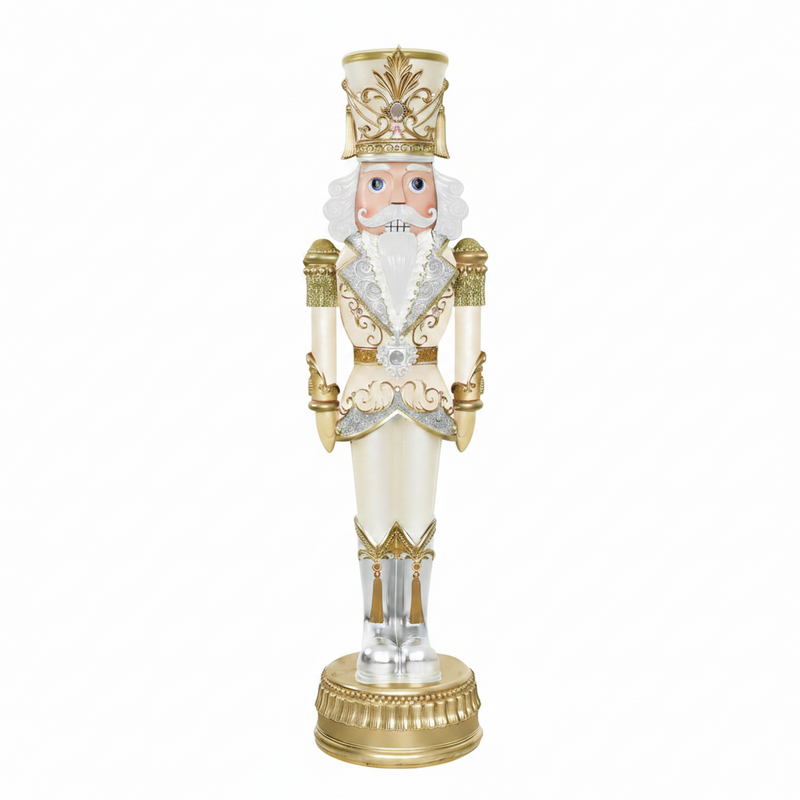 Decorative nutcracker figurine with gold and white attire on a white background