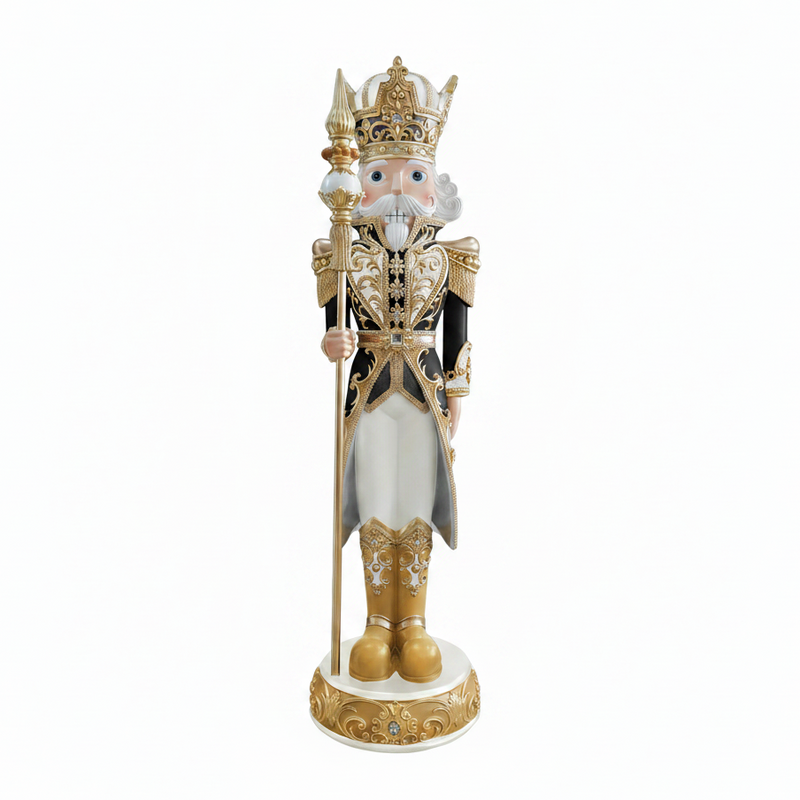 Decorative nutcracker figure with a crown and gold accents on a white background