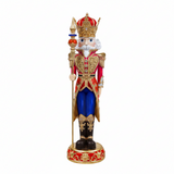 Decorative figurine of a king with a crown, holding a scepter, on a white background