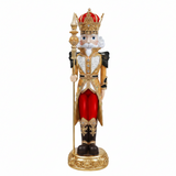 Decorative nutcracker figure with a crown and red outfit on a white background