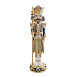 Decorative nutcracker figure with intricate details on a white background