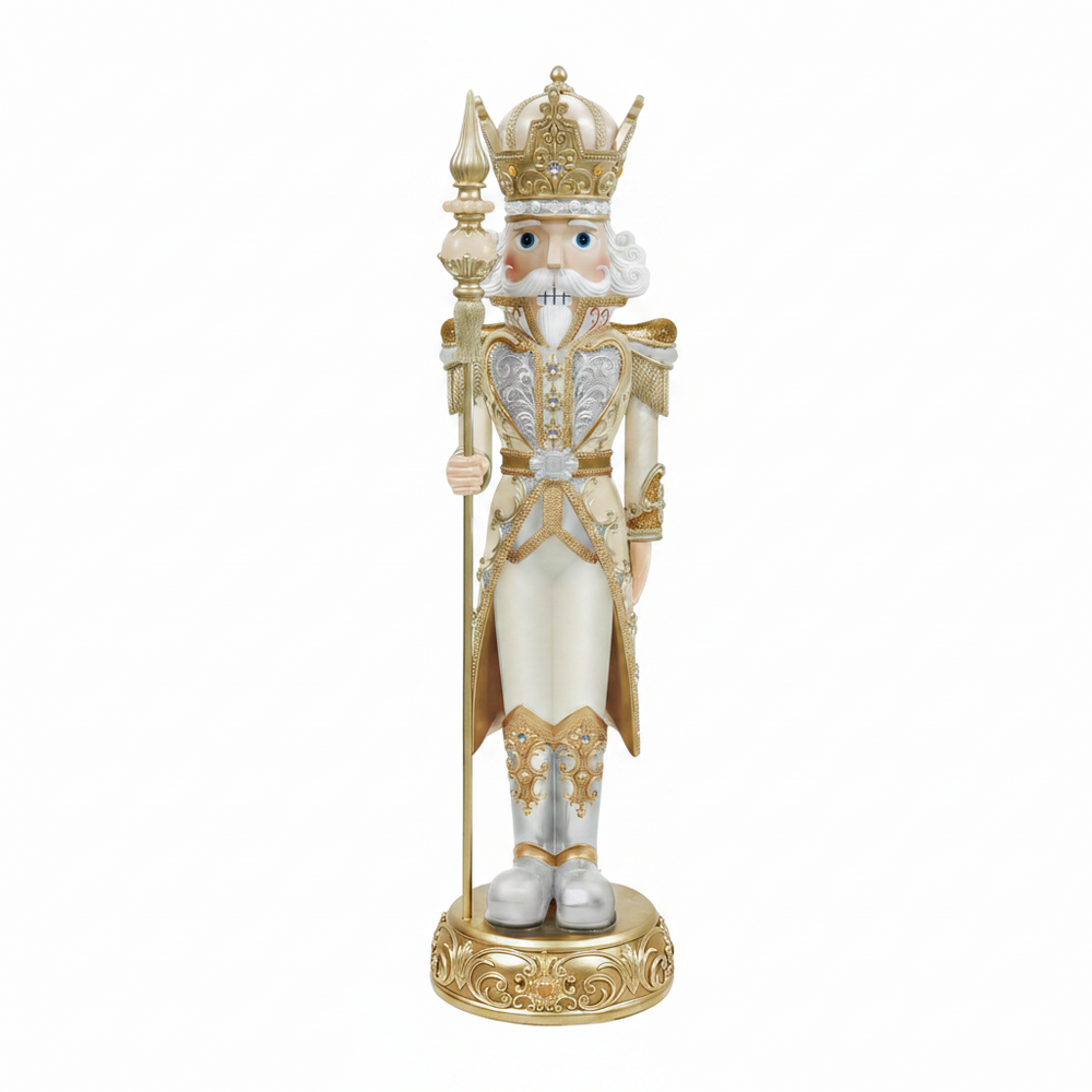 Decorative nutcracker figure with a crown and ornate outfit on a white background