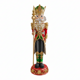 Decorative figure of a king with a crown, holding a scepter, on a white background