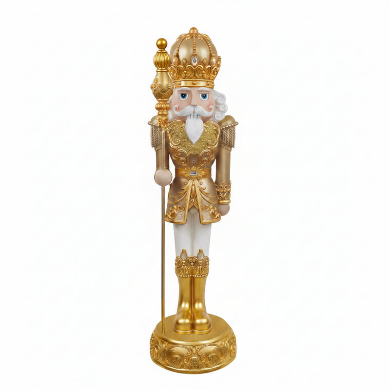 Decorative nutcracker figure with gold and white attire on a white background