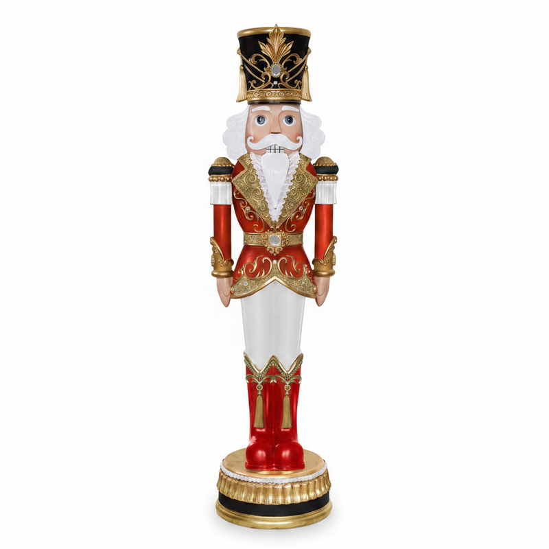 Decorative nutcracker figure with red outfit, white pants, and gold accents on a white background