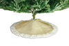 Beige Christmas tree skirt with white trim on a green Christmas tree.