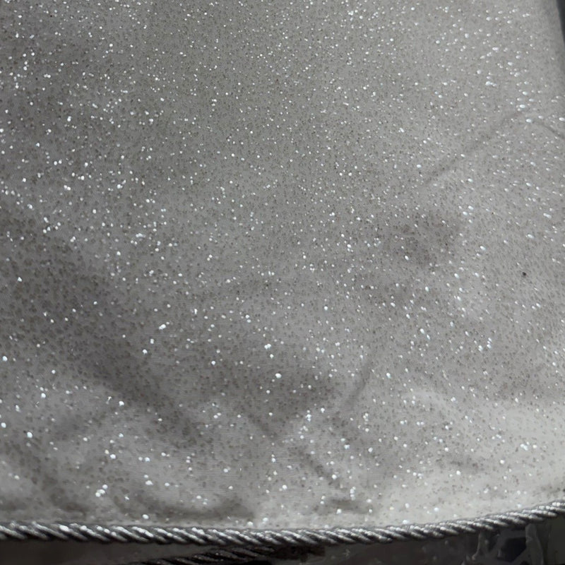 Close-up of silver fabric with glittery specks
