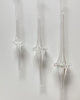 Clear glass pendant lights on a white background