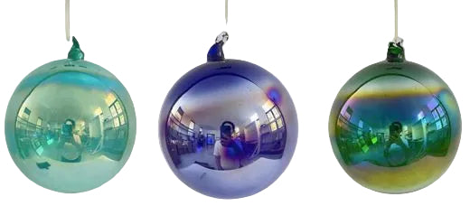 Three iridescent glass ornaments hanging against a white background
