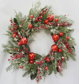 Decorative Christmas wreath with red ornaments and greenery on a white background