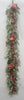 Decorative garland with red berries and green leaves on a white background