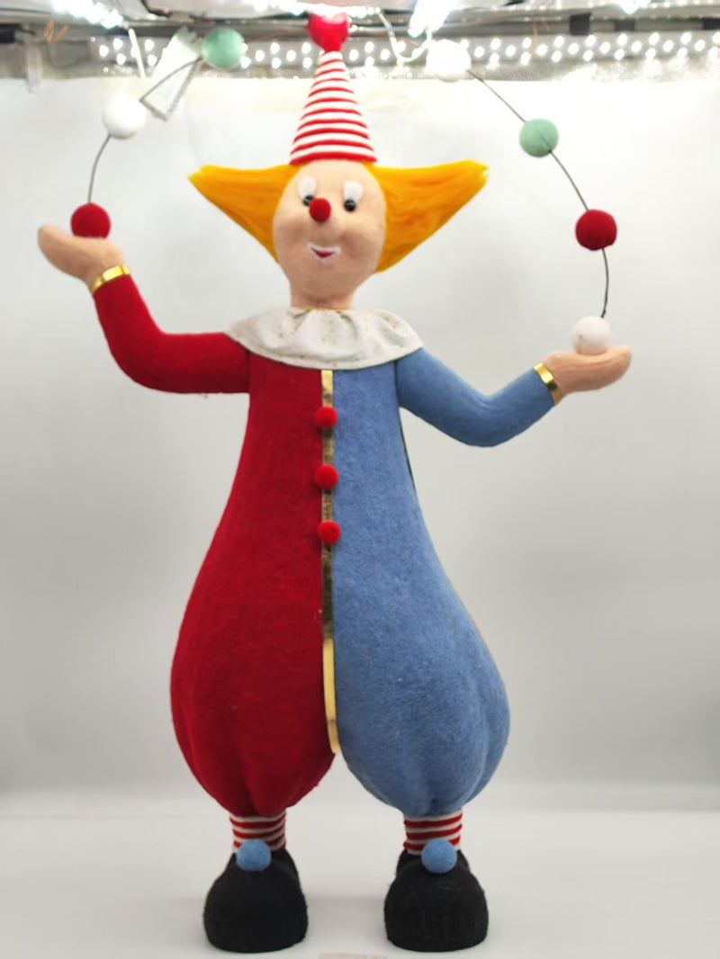 Colorful clown doll with red and blue outfit on a white background