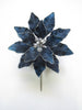 Blue flower-shaped brooch with pearl-like centers on a white background