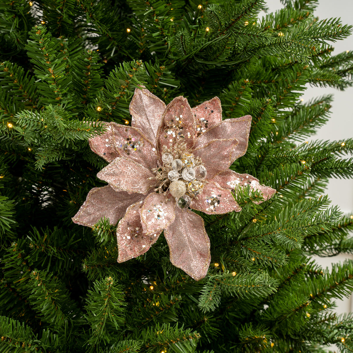 Decorative pink flower stick on a Christmas tree