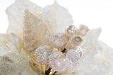 Decorative arrangement with pearls and crystals on a white background