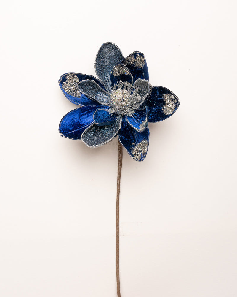 Blue flower-shaped hairpin on a white background