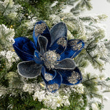 Blue floral ornament with glitter on a Christmas tree