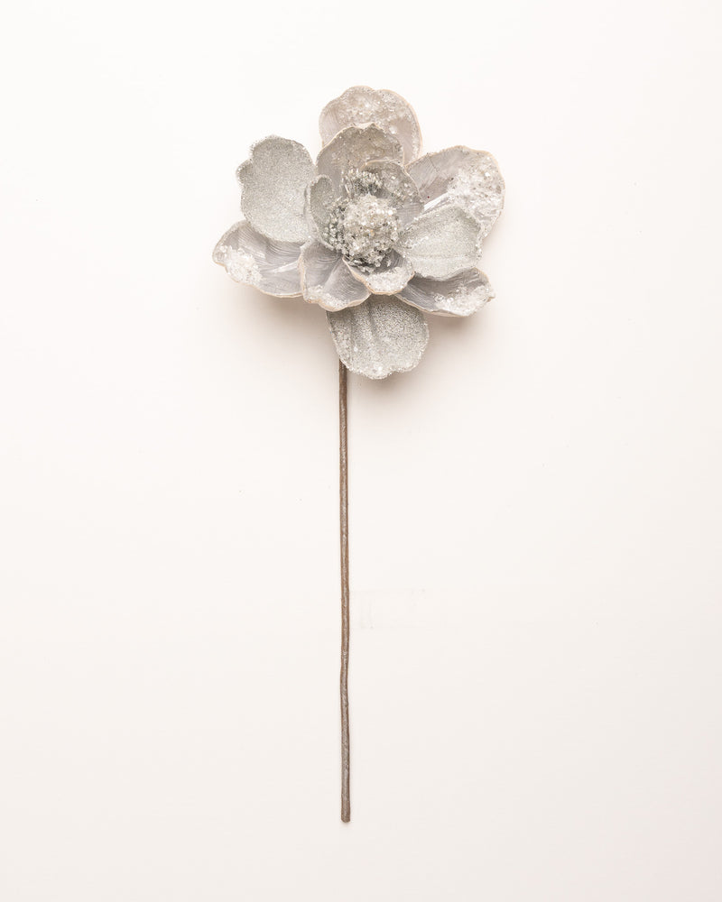 Silver flower-shaped hairpin on a white background