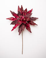 Decorative red poinsettia flower on a white background
