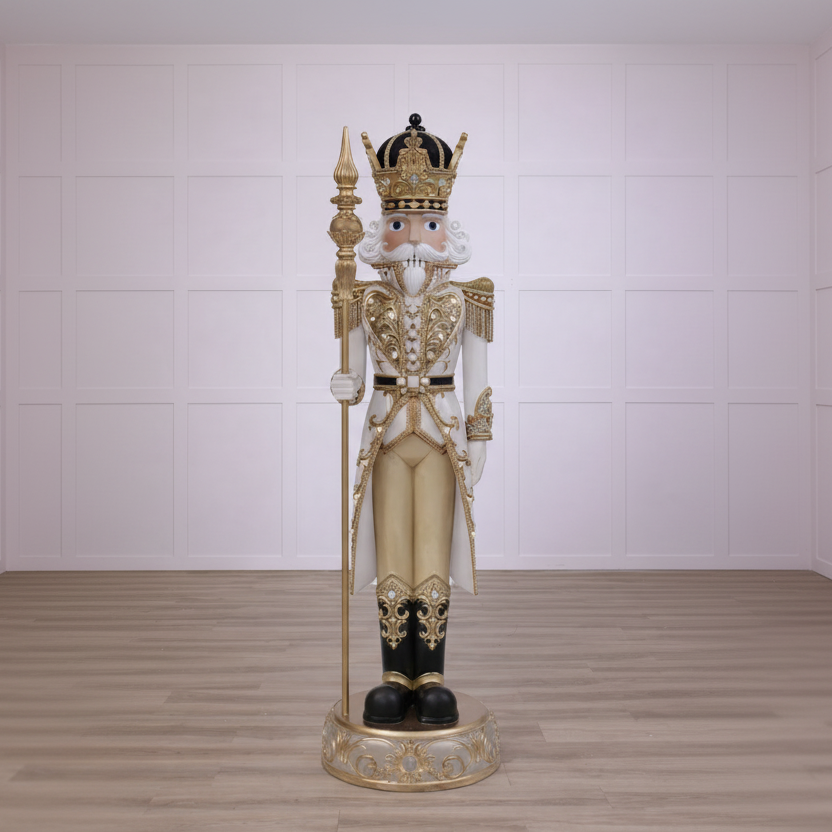 Decorative nutcracker figure with gold and black details on a white background