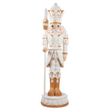 Decorative nutcracker figure with white and brown attire on a white background