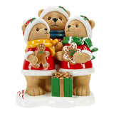 Three teddy bears in festive outfits with gingerbread cookies and a present on a white background