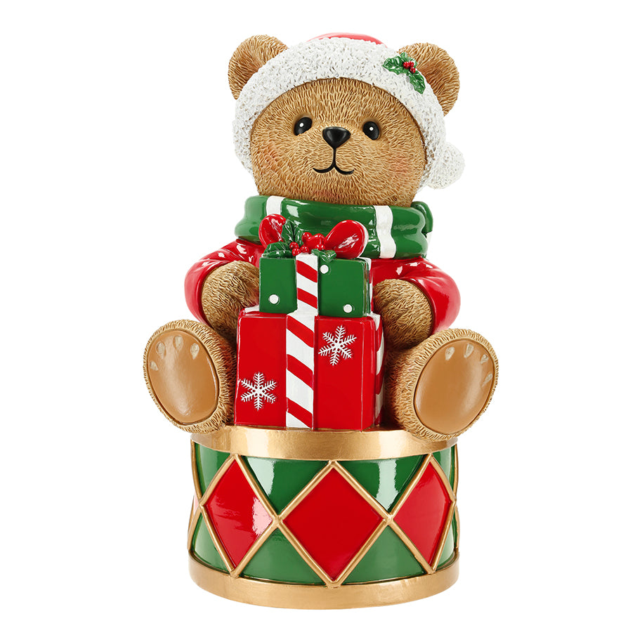 Decorative bear figurine with Christmas-themed accessories on a white background