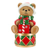 Decorative bear figurine with Christmas-themed accessories on a white background