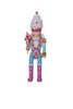 Colorful nutcracker figurine with ice cream hat and candy cane on a white background