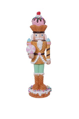 Decorative nutcracker figure with ice cream-themed outfit on a white background