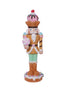Decorative nutcracker figure with ice cream-themed outfit on a white background