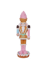 Decorative nutcracker figure with pastel colors on a white background