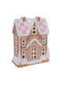 Decorative gingerbread house with checkered roof on a white background