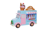 Toy ice cream truck with a small figure on top against a light gray background