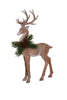 Decorative deer figure with antlers and a wreath on a white background