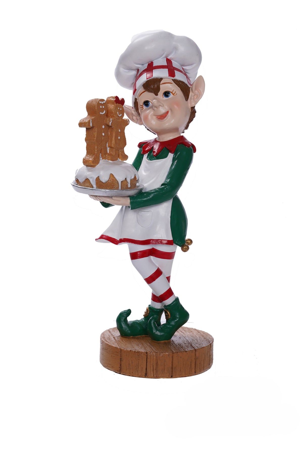 Elf figurine holding a gingerbread house on a white background