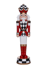 Decorative nutcracker figure with checkered pattern on a white background