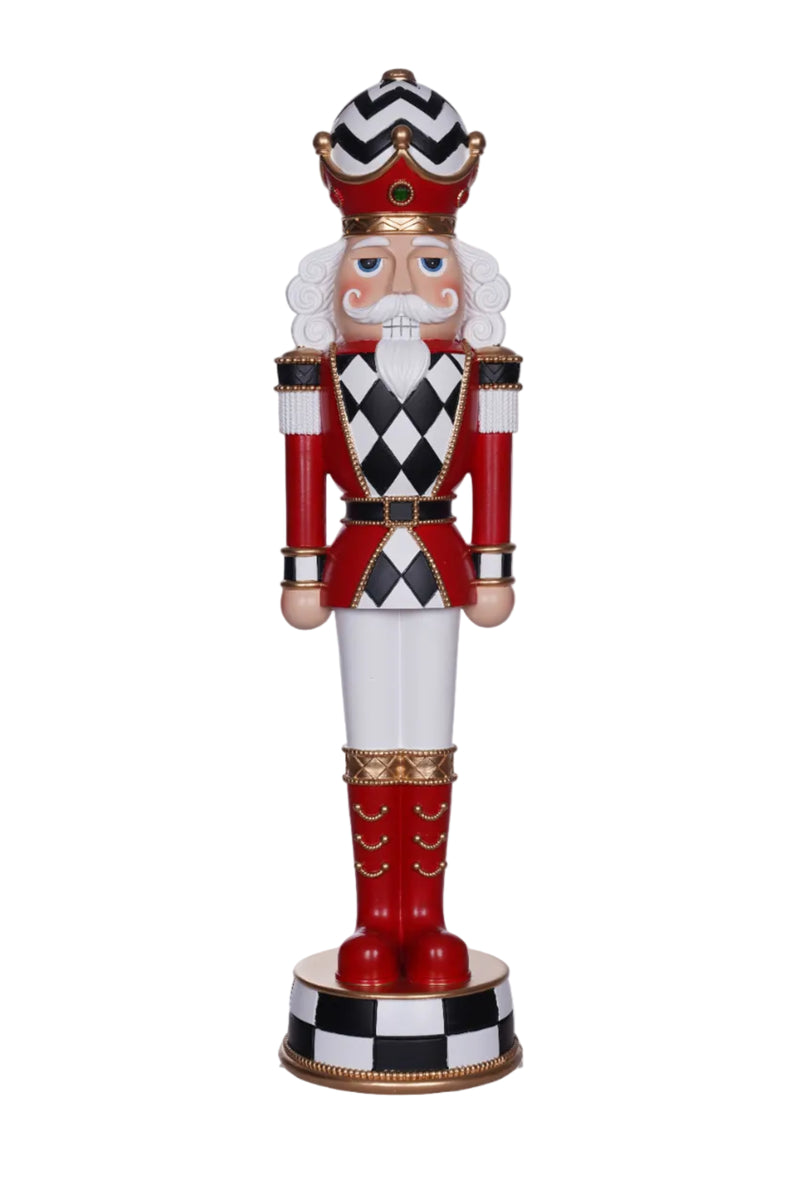 Decorative nutcracker figure with checkered pattern on a white background