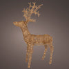 Decorative reindeer made of interwoven materials on a dark background