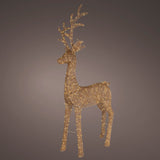 Decorative gold reindeer figure on a dark background
