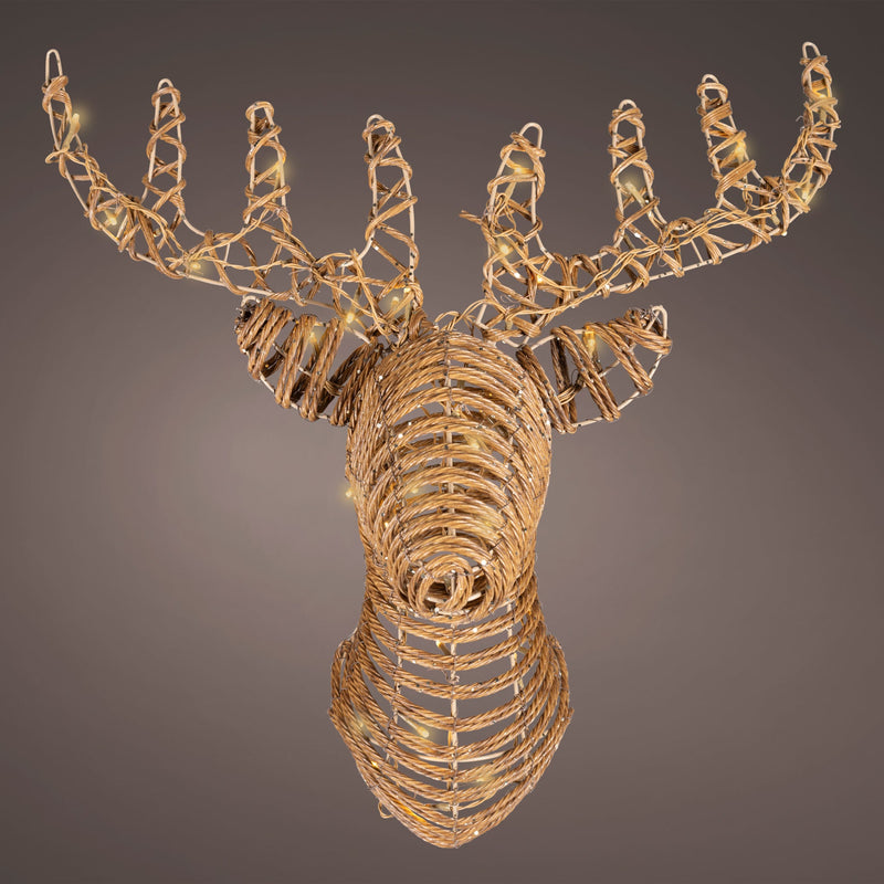 Decorative deer head sculpture made of woven materials on a dark background