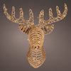 Decorative deer head sculpture made of woven materials on a dark background