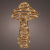 Decorative lamp shaped like a seashell with a textured surface on a dark background