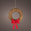 Decorative wreath with a red bow on a gray background