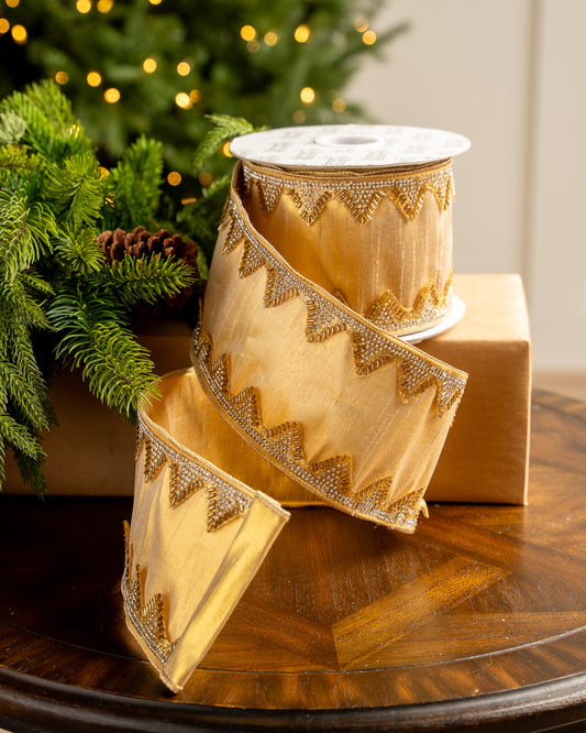 Gold ribbon with elegant, embroidered trim on a Christmas background